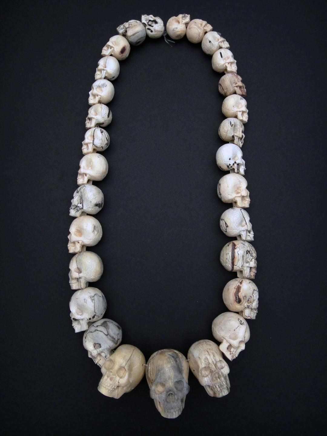 Carved Wood Skull Strand