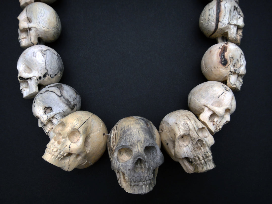 Carved Wood Skull Strand