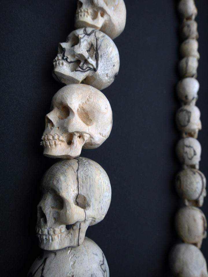 Carved Wood Skull Strand