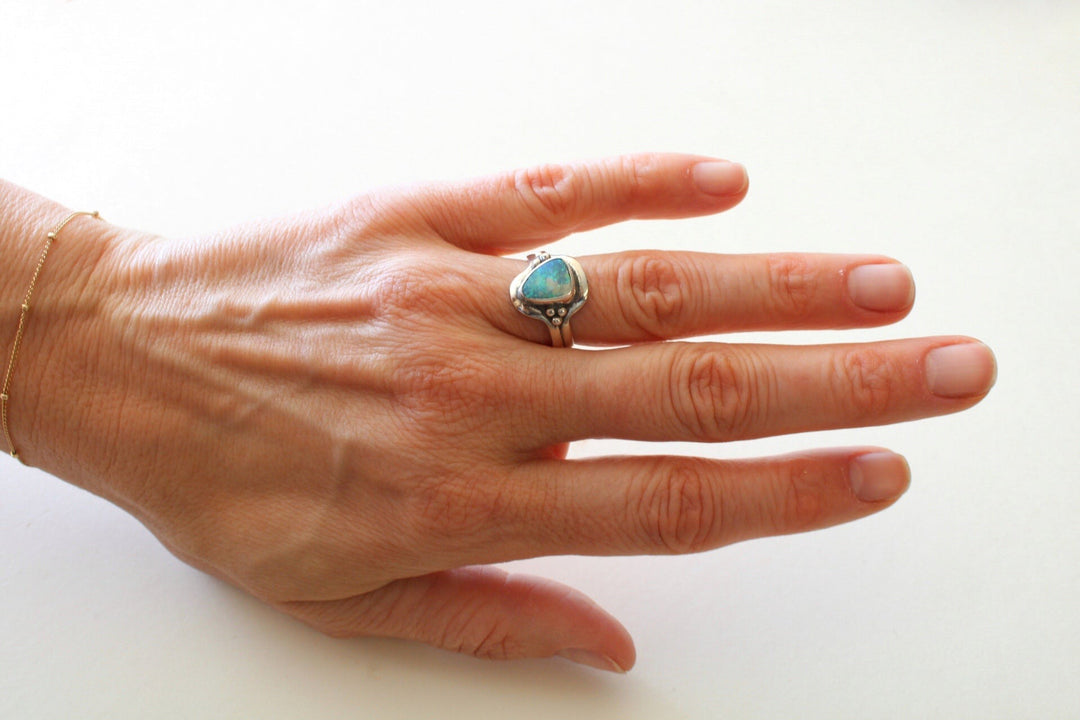 sterling silver ring with Australian opal modeled on ring finger